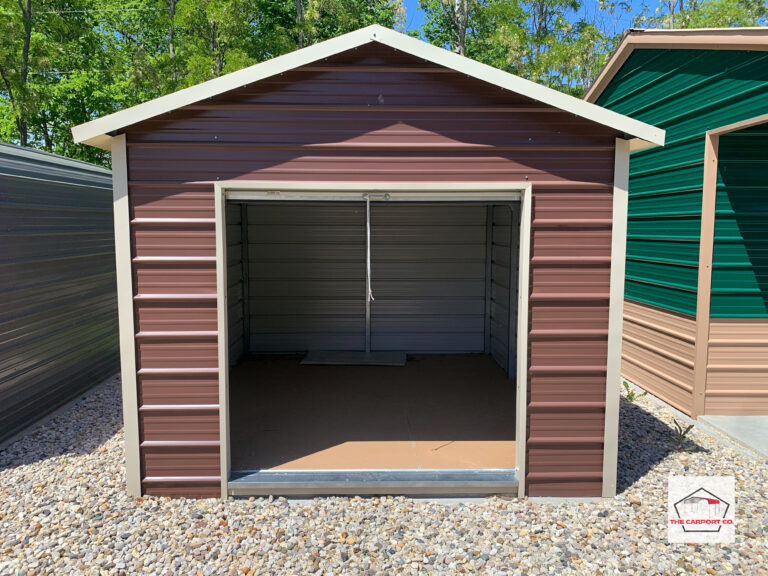 Center of metal shed with brown siding and tan trim with open 6x6 roll up door on front end.