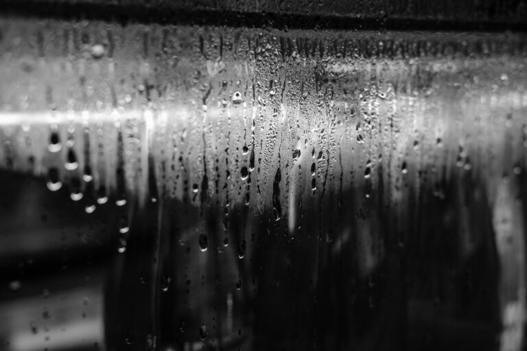 Photo of storefront showing condensation on window. Used in article to signify importance of insulating a metal carport or adding carport insulation to existing carport for moisture prevention reasons, AKA to stop metal carport from sweating.