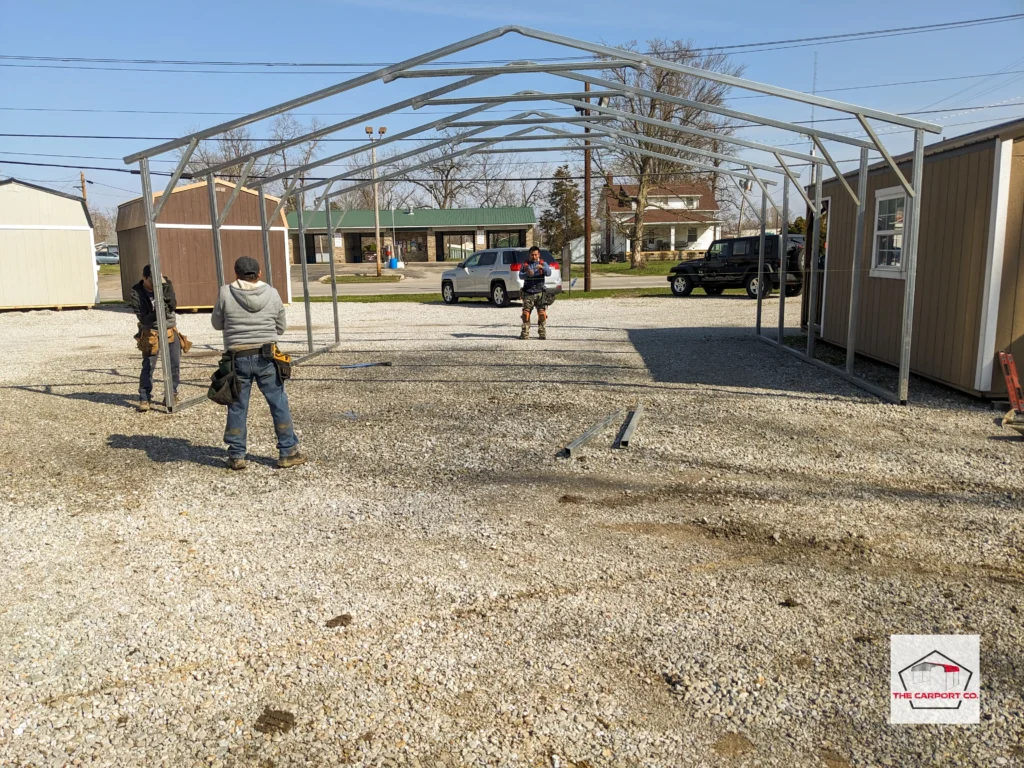 Photo of installation of a steel carport and metal garage installation from Indiana by a pre-fabricated metal building installation crew.